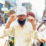 শ্রমজীবীদের মাঝে ক্যাপ বিতরণ